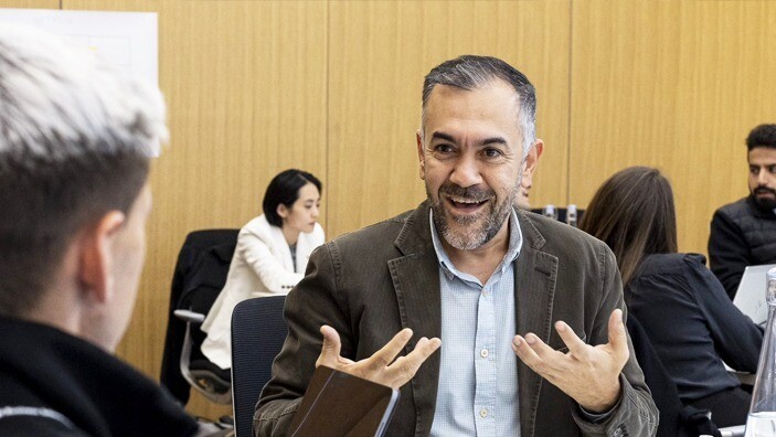 Executive education participant engaged in discussion during an Executive Education session.