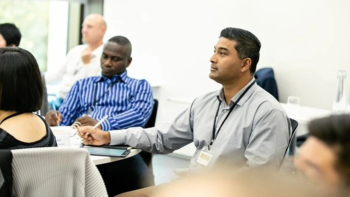 Participants listening attentively during an Executive Education session.