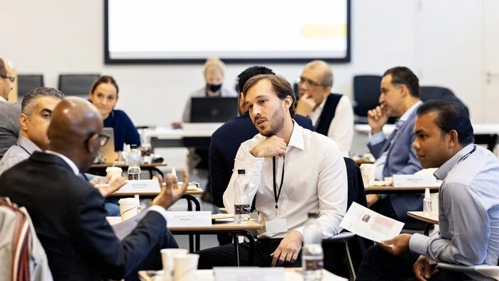 Participants engaging in discussion during an Executive Education session.