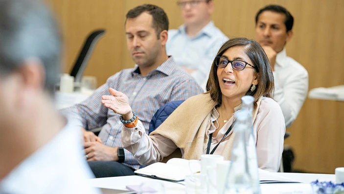 Participants engaging in discussion during an Executive Education session.