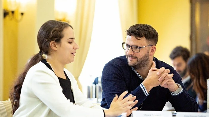 Two executive education participants engaged in discussion during an Executive Education session.