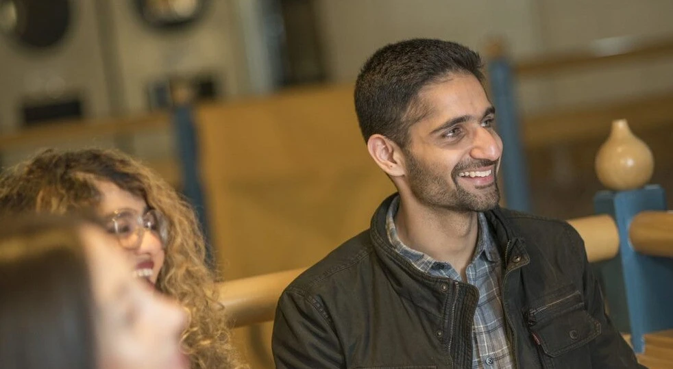 Students engaged in a discussion at Cambridge Judge.