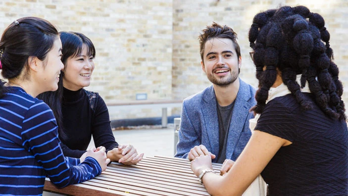 Students engaged in discussion at Cambridge Judge.