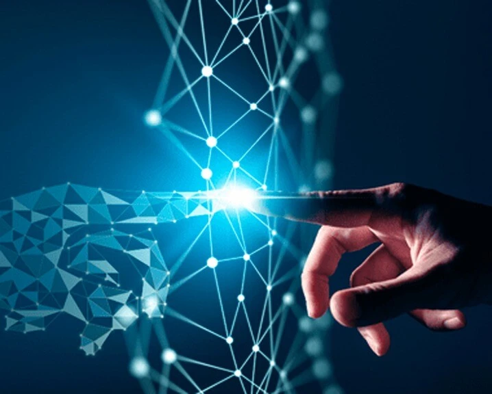 Hand reaching out to connect with digital nodes and lines, symbolizing innovation and technology.