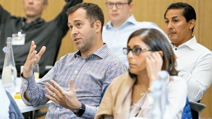 Participants engaging in discussion during an Executive Education session.