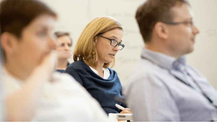 Participants listening attentively during an Executive Education session.