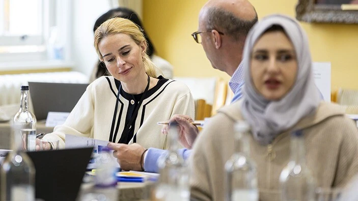 Participants engaging in discussion during an Executive Education session.