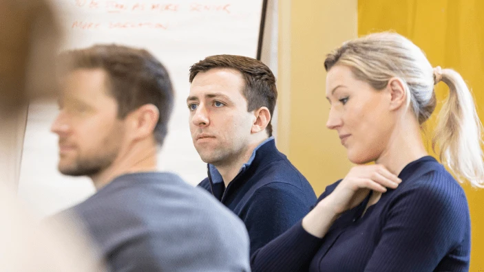 Participants listening attentively during an Executive Education session.