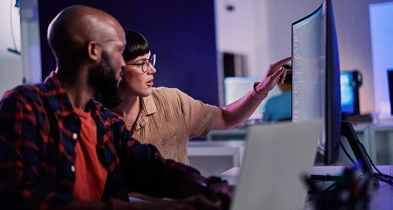 People looking at a computer screen.