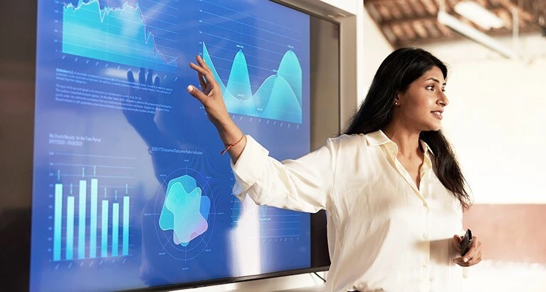A businesswoman giving a presentation on data.