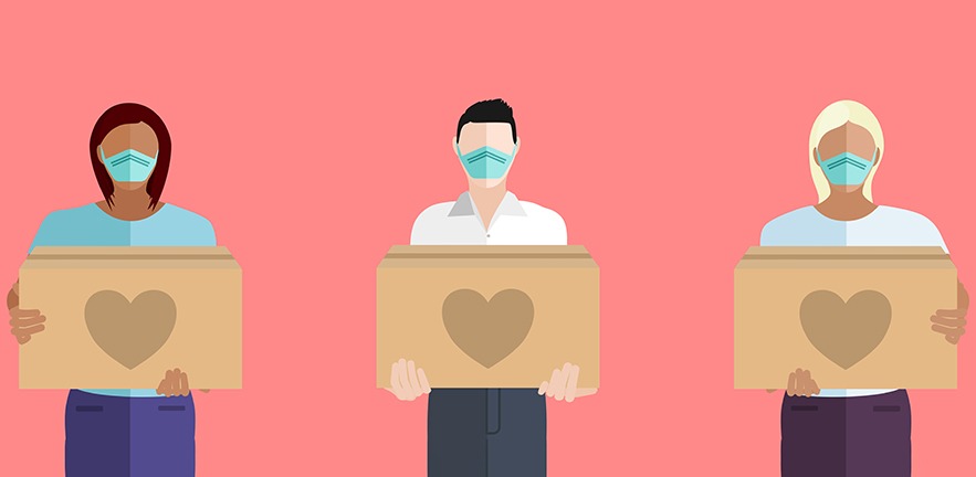 Multicultural people wearing masks volunteering to help others in need with boxes of donations.