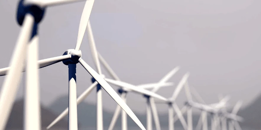 Bokeh effect on a long line of wind turbines.