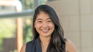 Annie Wang inside the Cambridge Judge Business School atrium.