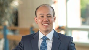 Calvin Liew inside the Cambridge Judge Business School atrium.