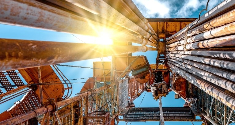 Fracking oil machinery, view from the ground towards the sky.