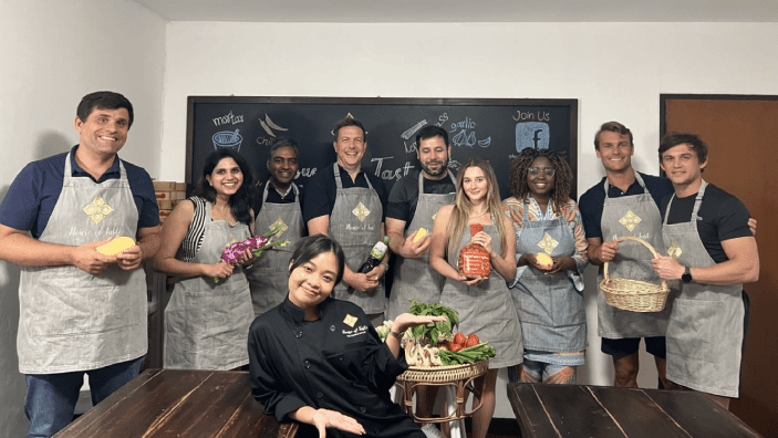 Kamiar Mohaddes joining a hands-on Thai cooking class in the heart of Bangkok.