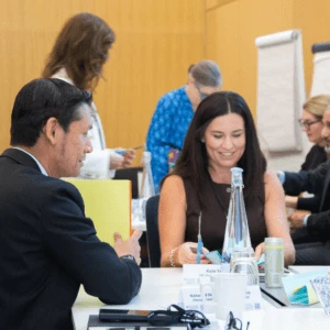 Delegates working on a group project at a desk