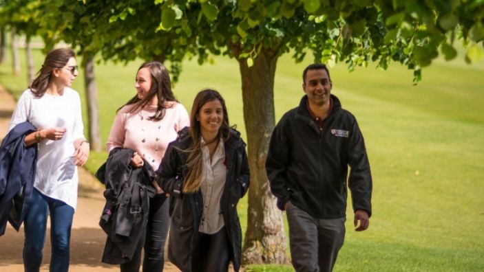 Students walking outside the Business School.