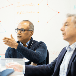 A senior leader asking the Professor a question in class