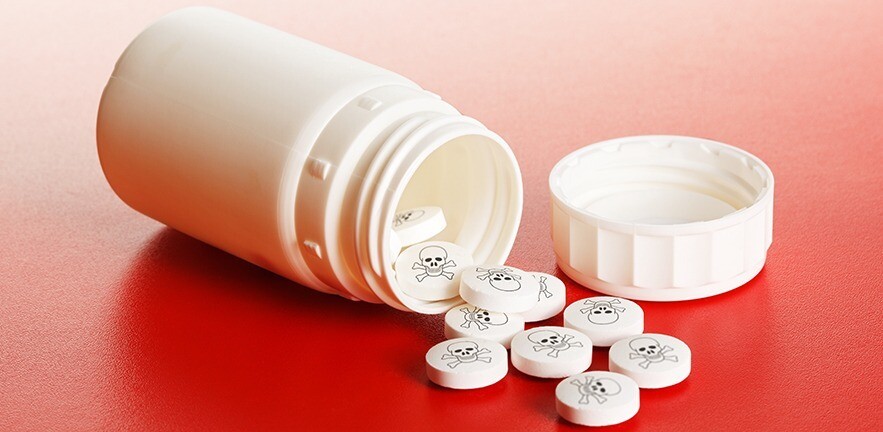 Poison pills stamped with a skull and crossbones.