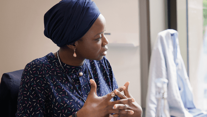 Senior woman leader contributing during a leadership development session at Cambridge Judge Business School.