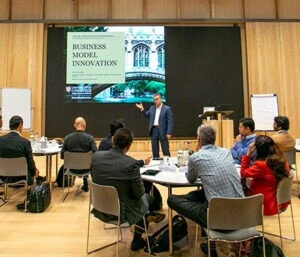 Faculty teaching a Managing Organisations Executive Education class.