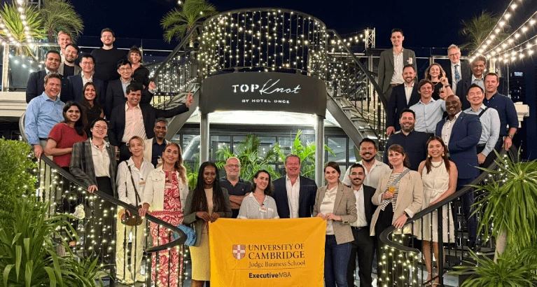 Kamiar with alumni and guests at the Top Knot Rooftop Bar and Restaurant.