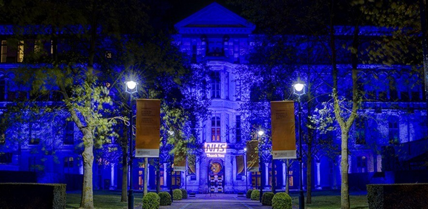 Cambridge Judge Business School lit in blue for NHS by Absolute Audio Visual Solutions.