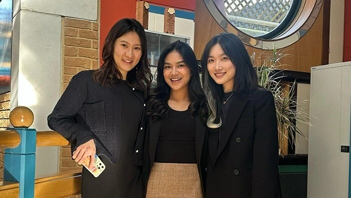 MFin classmates after a presentation.