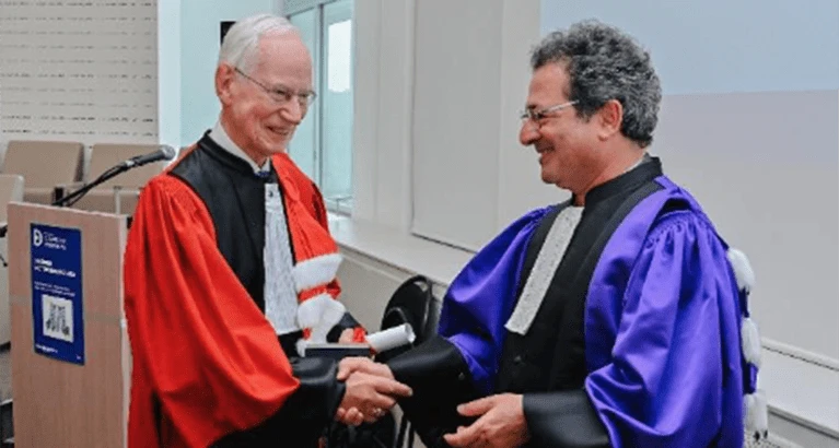 David Newbery receiving his honorary doctorate.