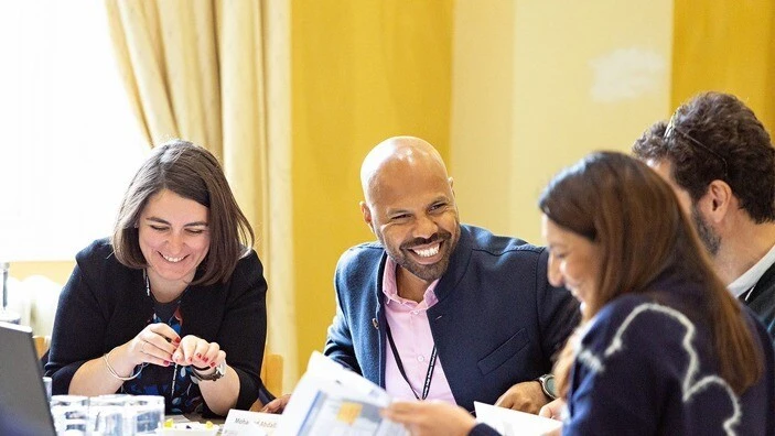 Participants engaging in discussion during an Executive Education session.