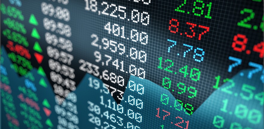 Close-up view of a stock market data board.