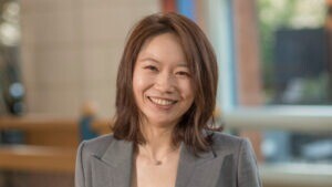 Ella Xing inside the Cambridge Judge Business School atrium.