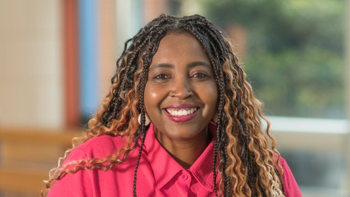 Katija Jaime-Gonsalves inside the Cambridge Judge Business School Atrium