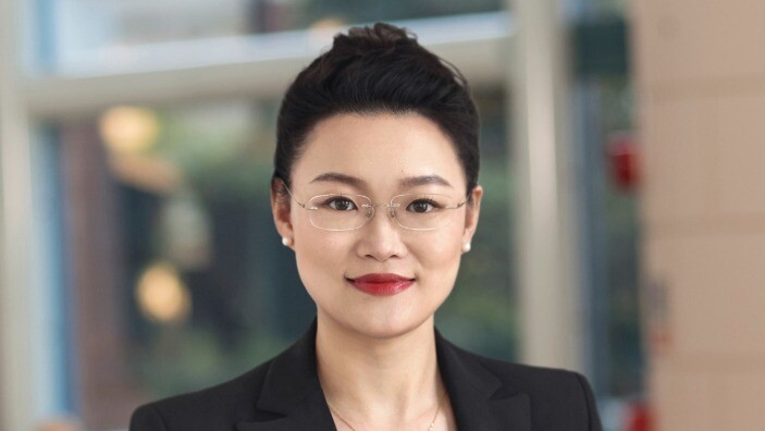 Janet Song's profile photo with her wearing a black suit.