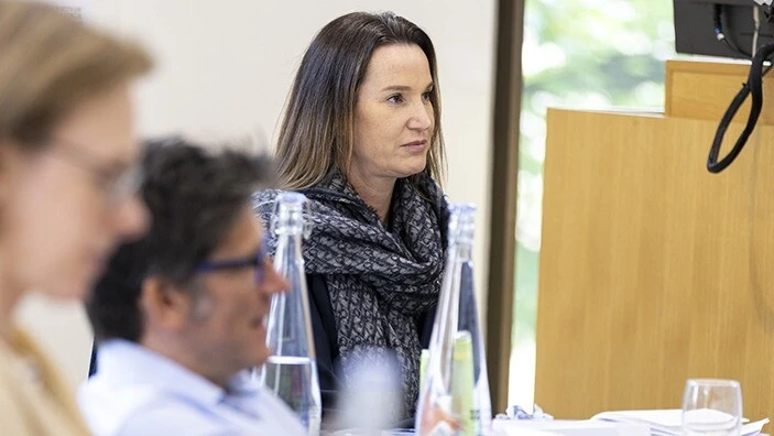 Woman listening intently.