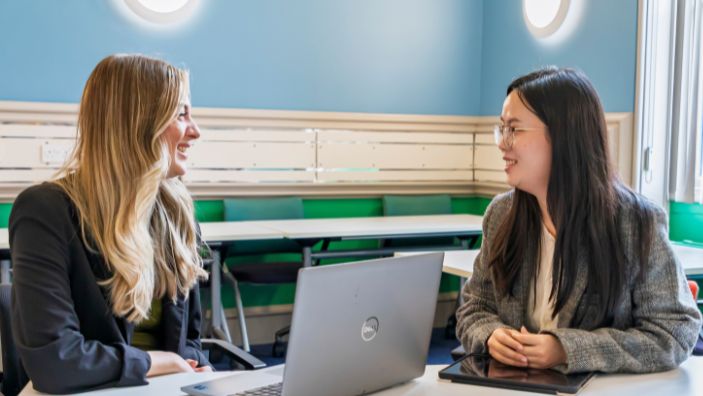 Two women engaging in a career development discussion.