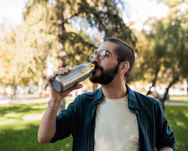 Man drinking from bottle.