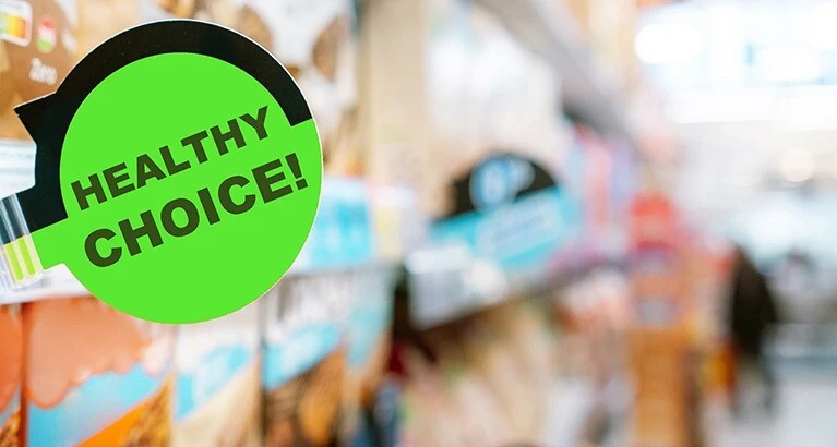 Healthy choice nudge label on supermarket shelf.