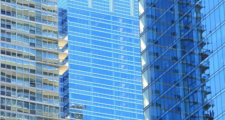 Reflective glass of city office buildings.