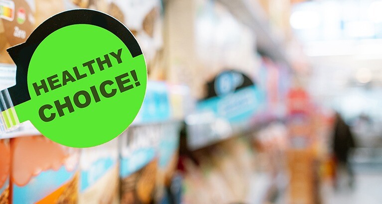 Healthy choice nudge label on supermarket shelf.