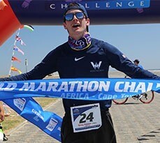 Greg Nance celebrating at the World Marathon Challenge finish line in Cape Town.