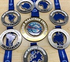 Medals from the World Marathon Challenge, representing seven continents and achievements in endurance running.