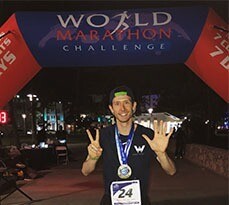Greg Nance celebrating after completing the World Marathon Challenge.
