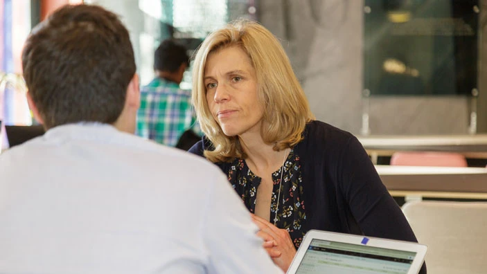 A woman engaged in an important discussion.