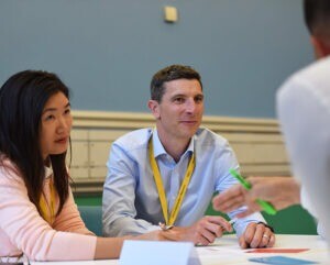 Cambridge Executive MBA students working.