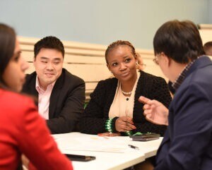 Cambridge Executive MBA students working.