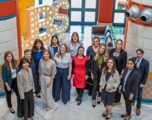 Careers team standing in main atrium of Cambridge Judge Business School