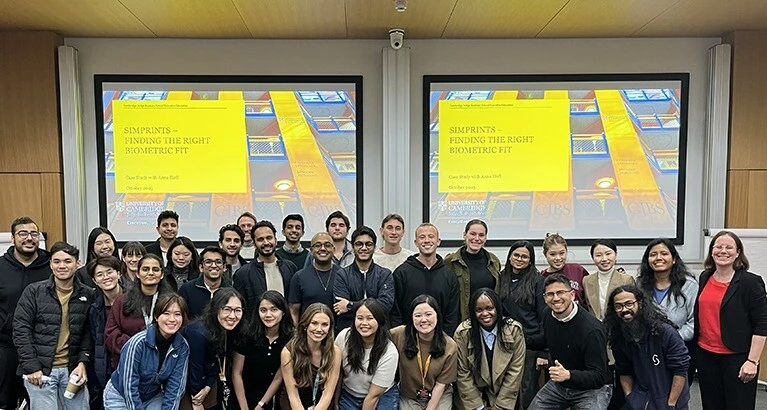 Simprints hosts with Cambridge Judge students at the event.