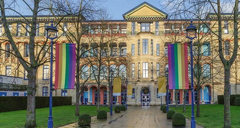 Pride flags outside Cambridge Judge Business School during Pride Month.